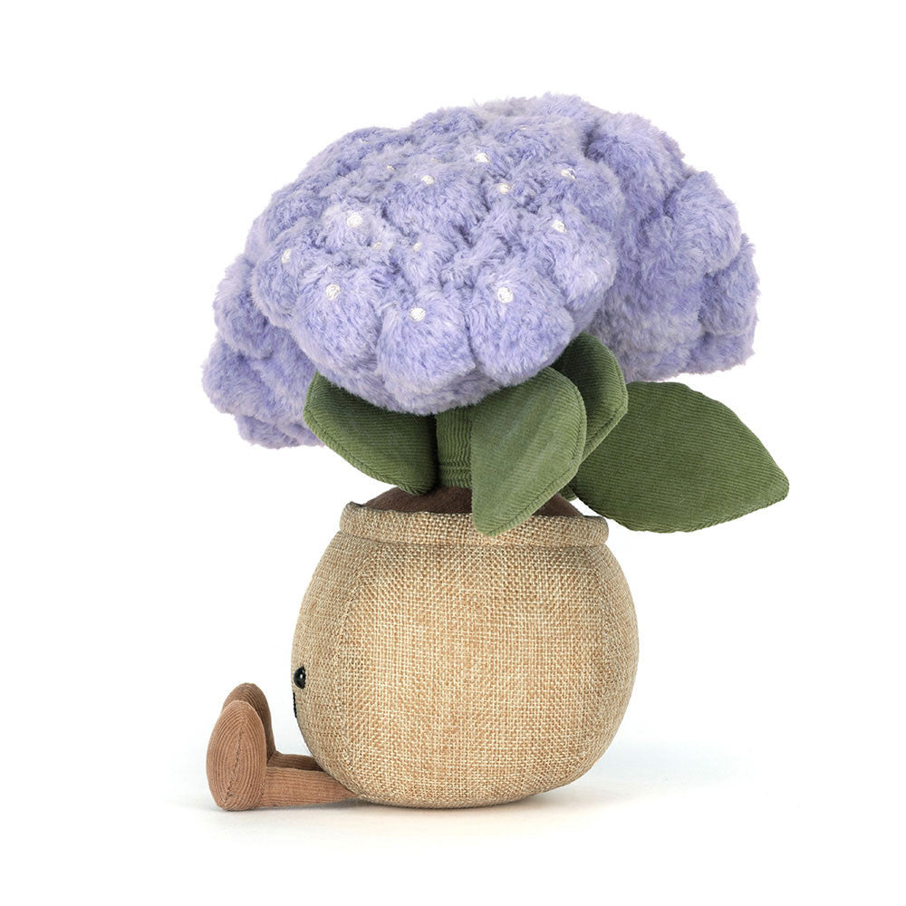 Jellycat Amuseables Hydrangea - Plüsch-Hortensie in lila/violett im braunen Topf mit lächelndem Gesicht und ausgestreckten Füßen