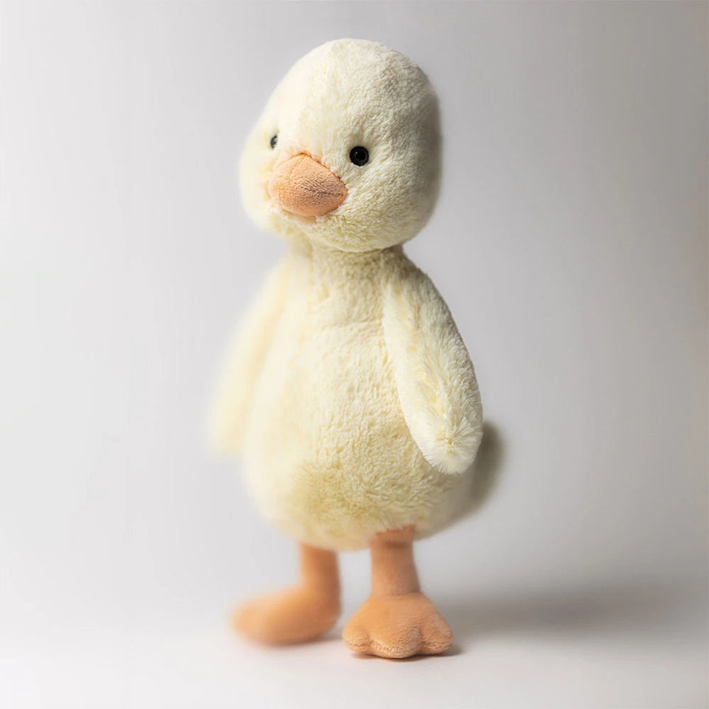 Kleine superweiche Jellycat Bashful Duckling Kuschelente mit süßem Gesicht und flauschigem gelbem Fell