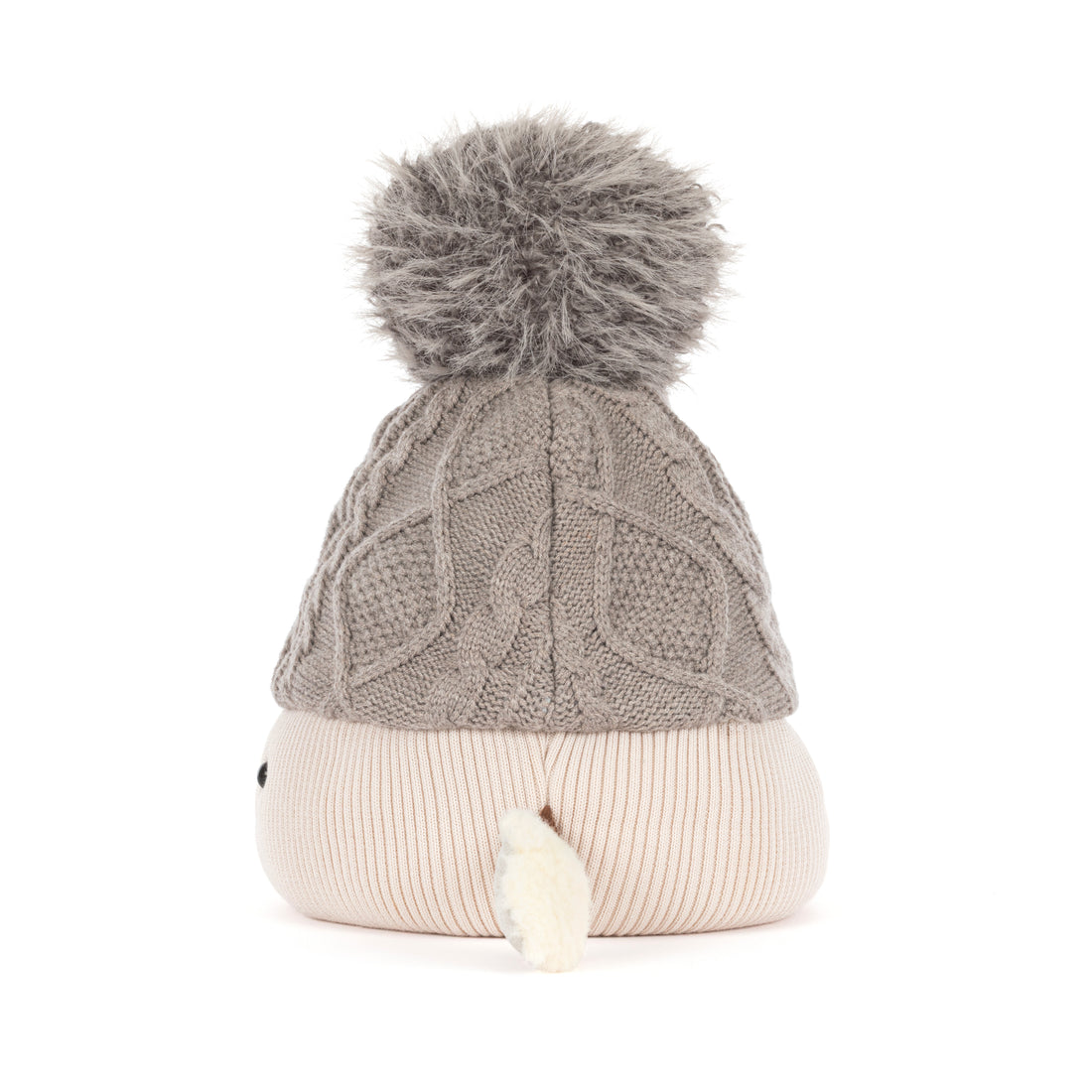 Jellycat Amuseables Pomilly Strickmütze in Grau mit großem Flausch-Bommel, behandschuhten Händen von der Seite