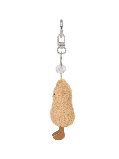 Jellycat Amuseables Peanut – kuscheliger Erdnuss Schlüssel- und Taschenanhänger mit kleinen Beinchen und silbernem Befestigungsring, von der Seite.