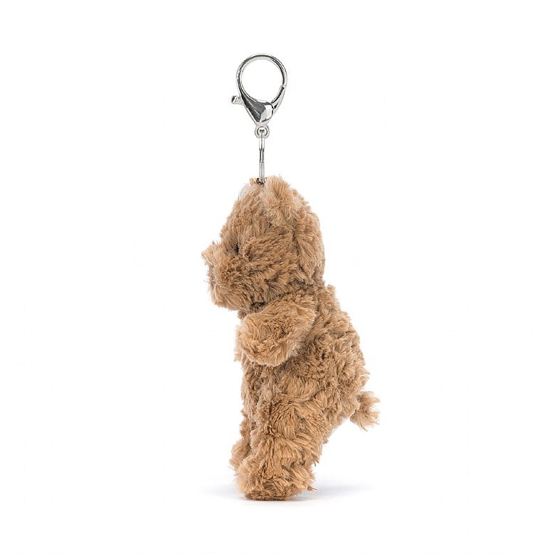 Seitenansicht: Jellycat Bartholomew Bear Bag Charm, brauner Plüschbär-Schlüsselanhänger mit süßem Gesicht