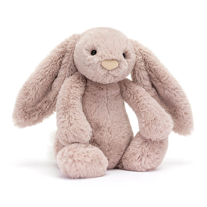 Vorderansicht: Jellycat Bashful Luxe Bunny Rosa Kuschelhase in zartem Rosa mit langen Hängeohren, schimmernder Nase und flauschigem Schwänzchen