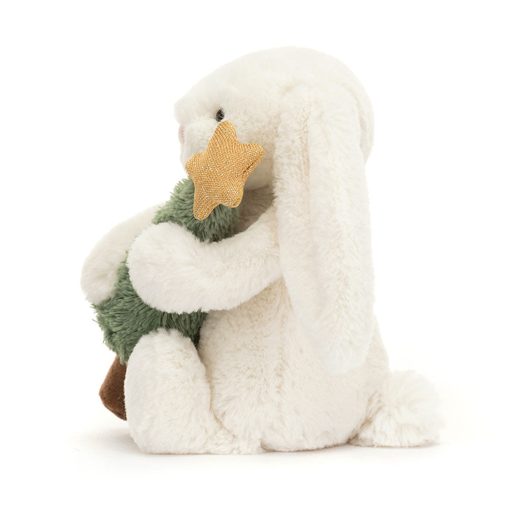 Seitenansicht Bashful Bunny with Christmas Tree von Jellycat.