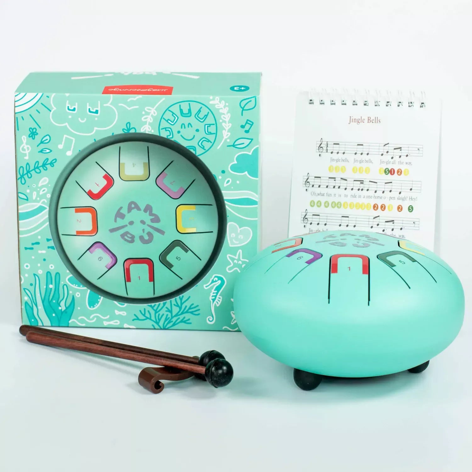 Das Baby Tambu von juegaconmigo mit Aufbewahrungstasche, Trommelstöcken, Trommelstockhalter und Notenbuch zum Aufstellen. 