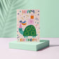 Grußkarte mit Umschlag: Happy Birthday Schriftzug und einer feiernden Schildkröte.