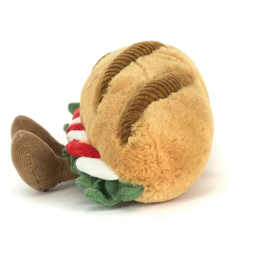 Jellycat Amuseables „Caprese Baguette“ lächelndes Plüsch-Baguette mit Füßchen, belegt mit Tomaten, Mozzarella, Basilikum