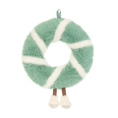 Jellycat Amuseables Pinecone Wreath – flauschiger Weihnachtskranz in Mintgrün und Cremeweiß mit kleinen Tannenzapfen, lächelndem Gesicht und weißen Füßchen, von hinten.