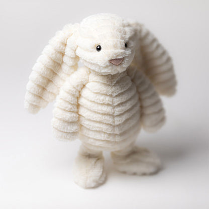 Jellycat Bashful Luxe Bunny Nimbus, weißer Plüschhase mit leicht welligem Fell, langen Hängeohren, rosa Näschen und extra flauschigem Puschelschwänzchen