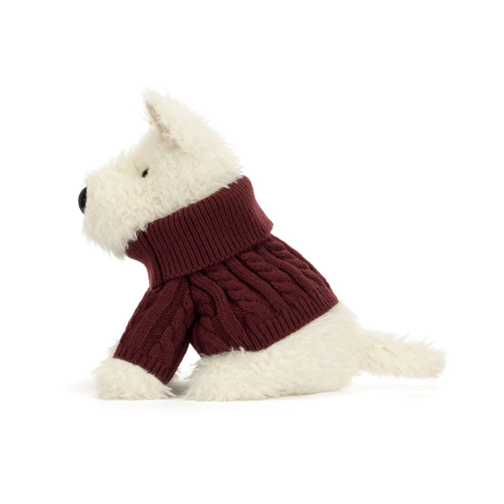 Jellycat Munro Scottie Dog Winter Jumper, weißer Plüschhund mit bordeauxrotem Strickpullover, sitzend von der Seite