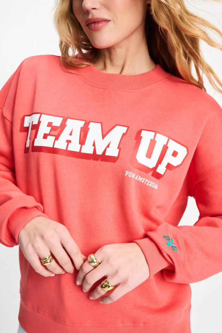 Orange Sweatshirt TEAM UP von POM AMSTERDAM mit weißem Print, sportlich-lässiger Look Vibe
