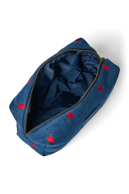 Innenansicht: Innenansicht der Pouch mit dunkelblauem, glänzendem Stoff und Reißverschluss