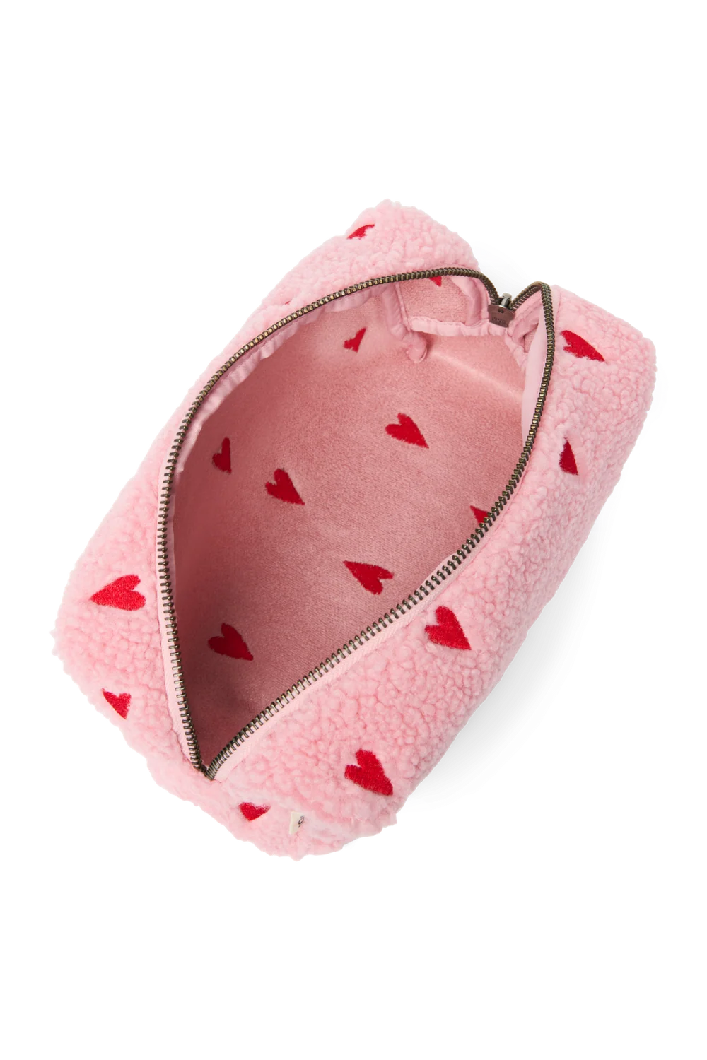 Innenansicht der Studio Noos Pouch aus pinkem Teddystoff mit gestickten roten Herzen und Reißverschluss