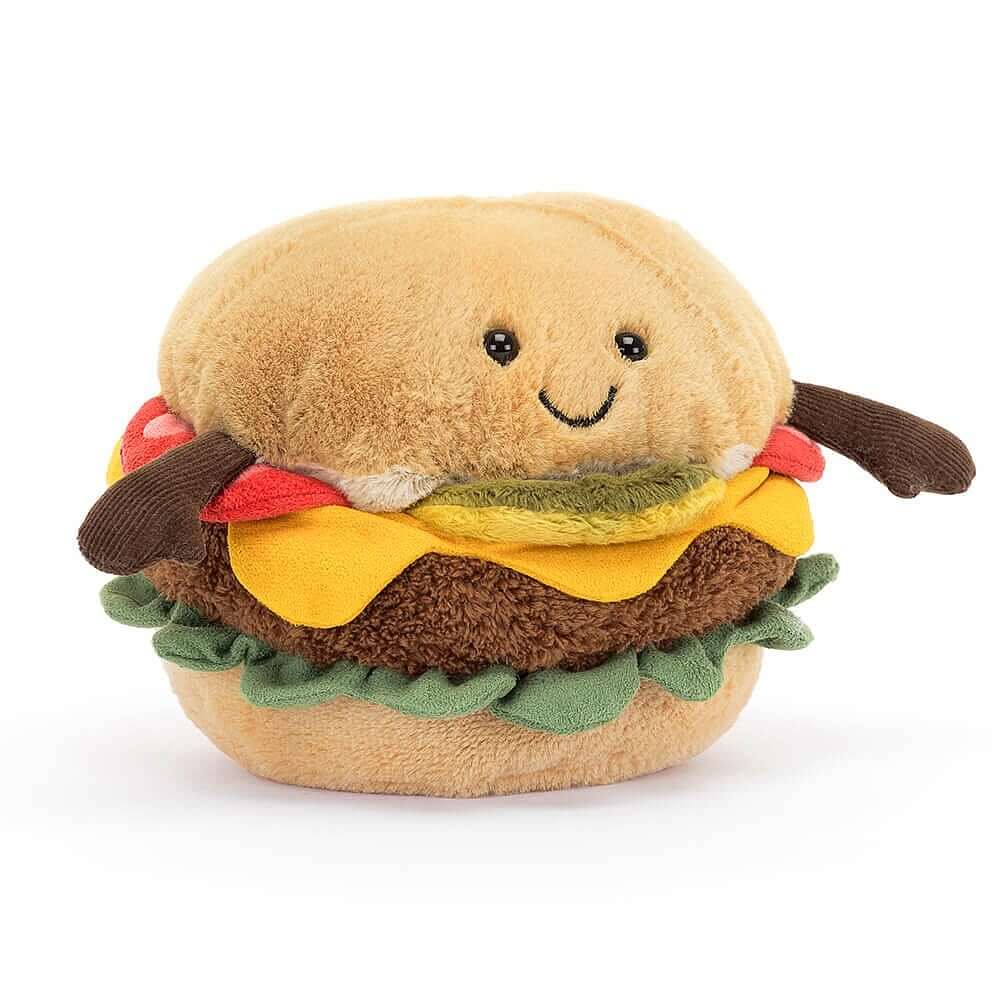 Vorderansicht: Jellycat Amuseables Burger – sitzendes Burger-Kuscheltier mit Brötchen, Salat, Käse, Burger-Patty, Tomate, Gurke, braunen Füßchen und lachendem Gesicht mit schwarzen Knopfaugen.